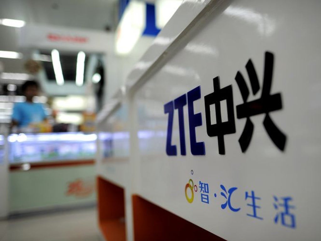 A ZTE logo is diplayed on a sales counter in Wuhan, central China's Hubei province. The US should block mergers and acquisitions by Huawei Technologies and ZTE, among the world's leading suppliers of telecommunications gear and mobile phones, an official report says