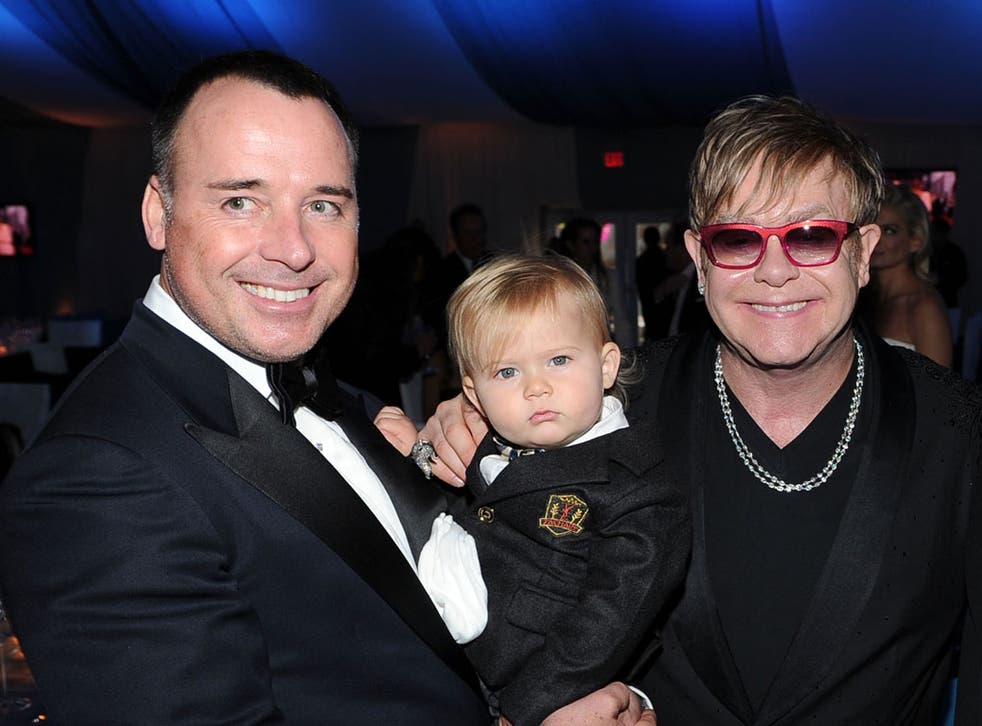 David Furnish, Sir Elton John and their son Zachary attend the 20th Annual Elton John AIDS Foundation Academy Awards Viewing Party at The City of West Hollywood Park on February 26, 2012 in Beverly Hills, California