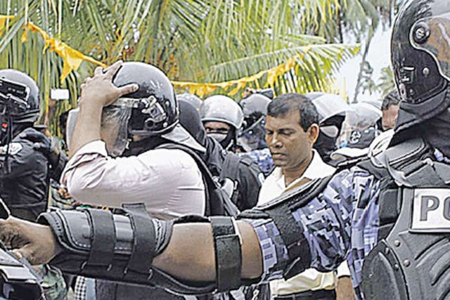 Police arrest Mohamed Nasheed in Fares Maathodaa after he failed to turn up for the start of a trial for alleged abuse of power