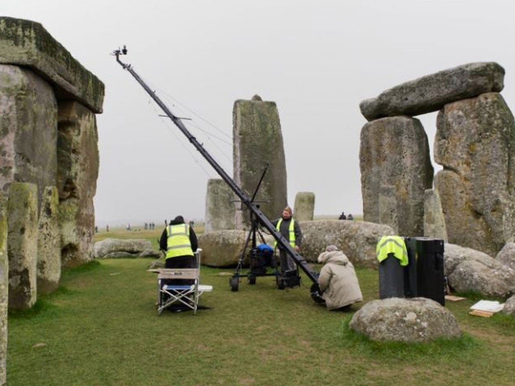 Surveyors carry out the laser-scans of the Stonehenge monuments,
which revealed 72 images of Stone Age ‘artwork’