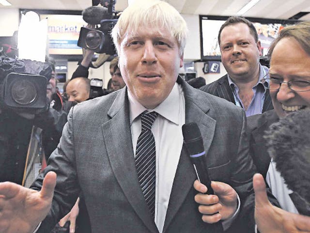 Boris Johnson creates a stir as he arrives at Birmingham New Street railway station to attend the Tory conference