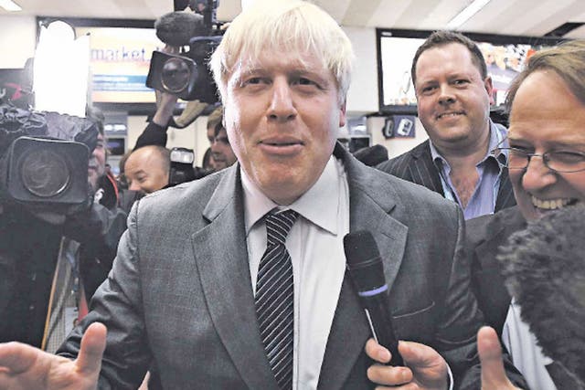 Boris Johnson creates a stir as he arrives at Birmingham New Street railway station to attend the Tory conference