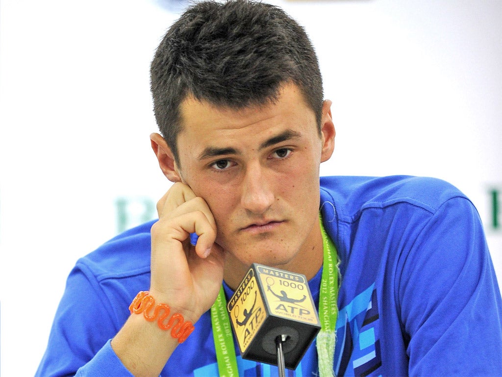 Bernard Tomic cuts a miserable figure after yesterday’s mauling