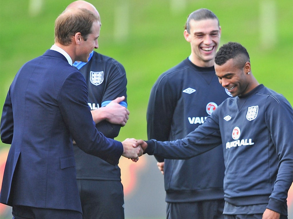 Prince William meets Ashley Cole who he joked was a 'naughty boy'