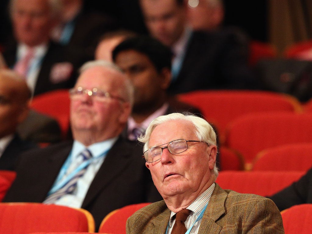 A delegate sleeps as justice secretary at the Conservative party conference in the International Convention Centre on October 9, 2012 in Birmingham, England.