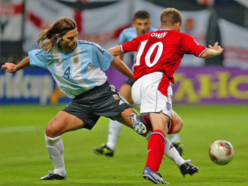 Michael Owen takes a tumble against Argentina in 2002