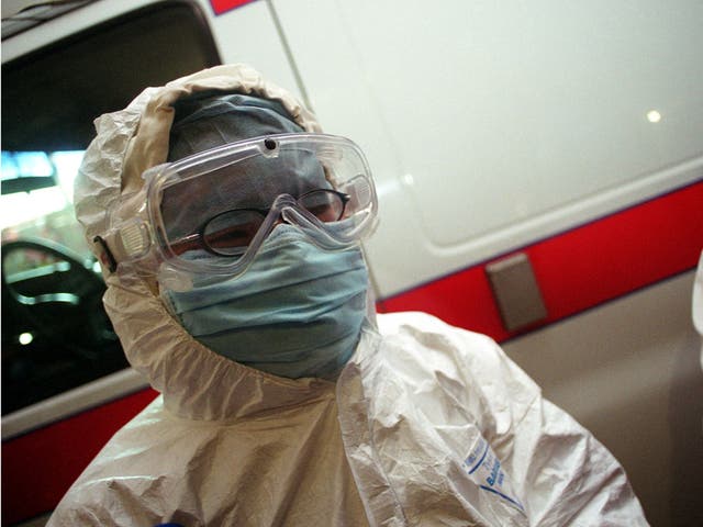 A medical worker wares a full protective suit at the Beijing Emergency Centre April 30, 2003 in Beijing, China.