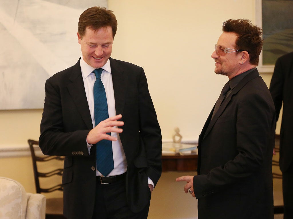 Deputy Prime Minister Nick Clegg (L) meets with Bono on October 11, 2012 in London, England. Mr Clegg and Bono met in the Deputy Prime Minister's office to discuss international development issues.