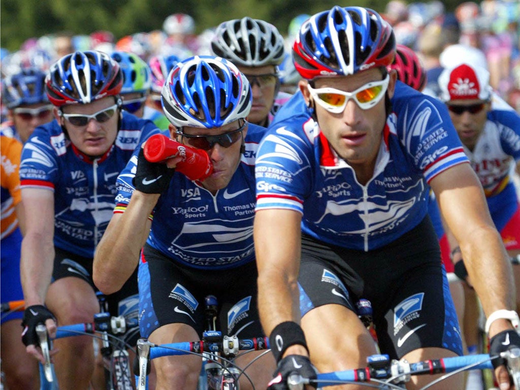 Lance Armstrong (centre), Floyd Landis (left) and George Hincapie during the 2002 Tour de France