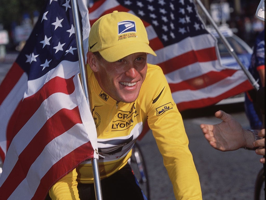 Lance Armstrong celebrates winning the 2001 Tour de France