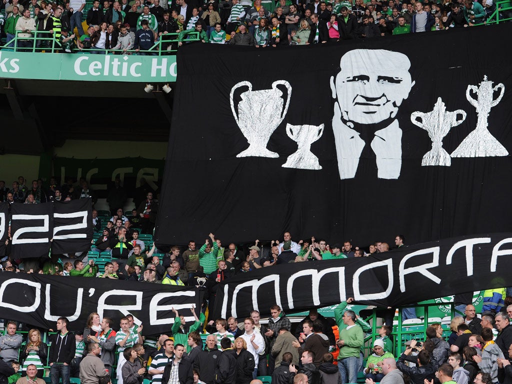 Celtic fans hold a minute's applause to mark the 25th anniversary of Jock Stein's death at Celtic Park