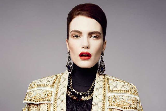 Beaded jacket and skirt, both from a selection, and black top, £400, all balmain.com; earrings, £890, and black feather necklace, £850, both lanvin.com