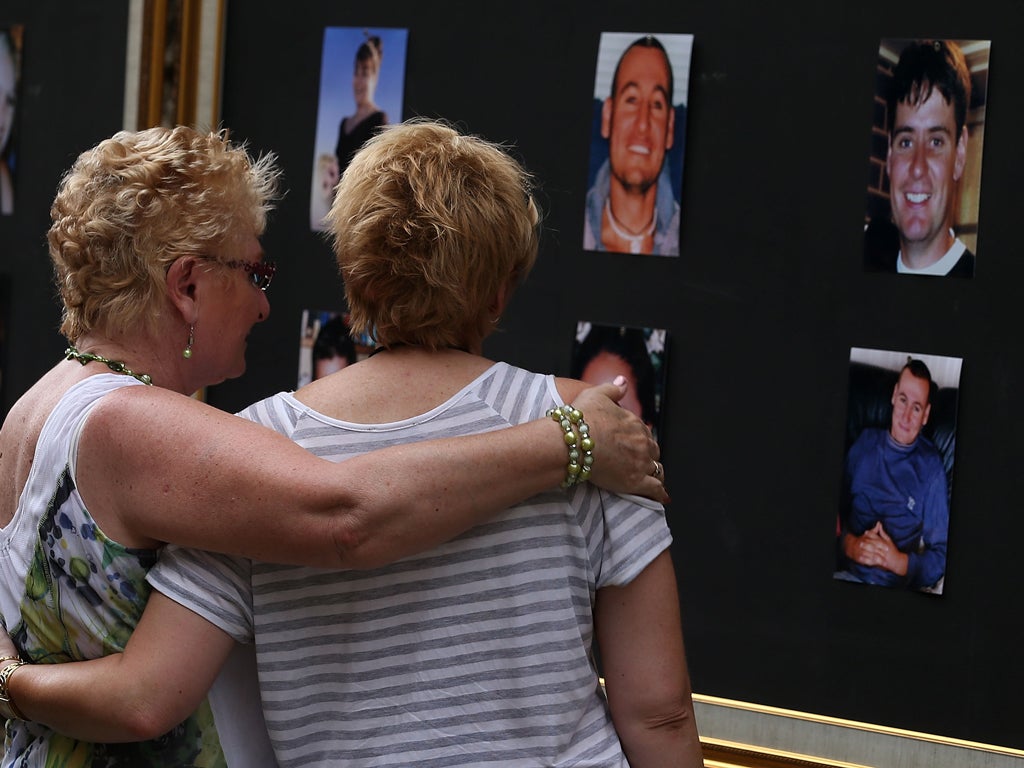 Relatives of victims of the 2002 bombings comfort one another