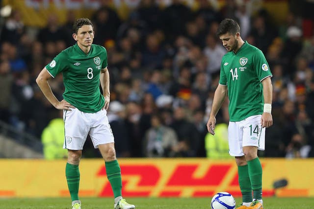 Keith Andrews and Shane Long of the Republic of Ireland look disheartened after Germany's sixth goal goes in