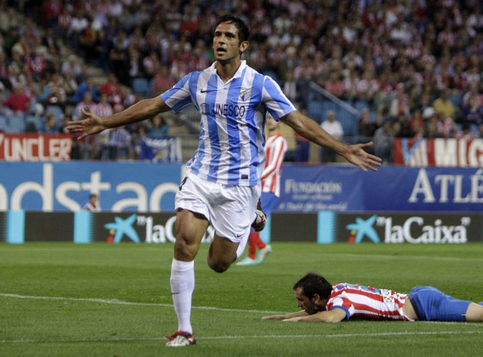 Roque Santa Cruz celebrates scoring against Atletico de Madrid in a La Liga game