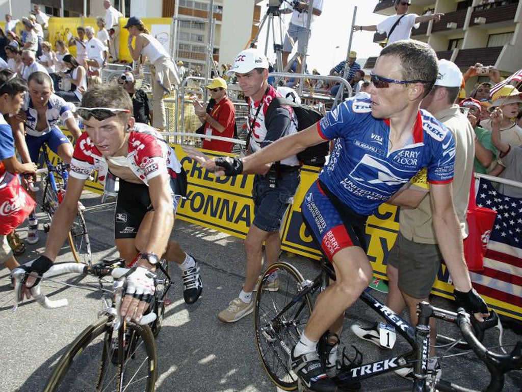 Lance Armstrong (right) with Tyler Hamilton at Alpe D’Huez in 2003