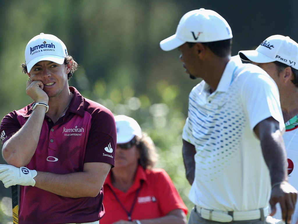 Tee break: Rory McIlroy and Tiger Woods chat during the Turkish Airlines World Golf Final at Antalya