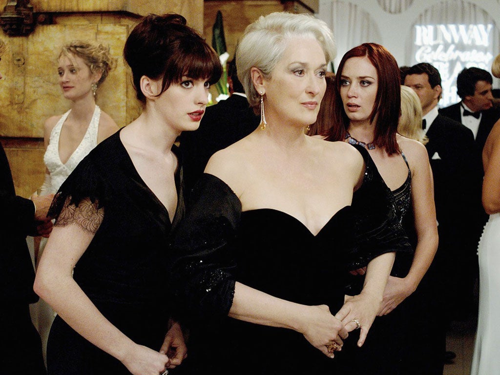 No mercy: Emily Blunt, far right, glares at her rival Anne Hathaway as she usurps her advisory role to Meryl Streep, centre, in 'The Devil Wears Prada'