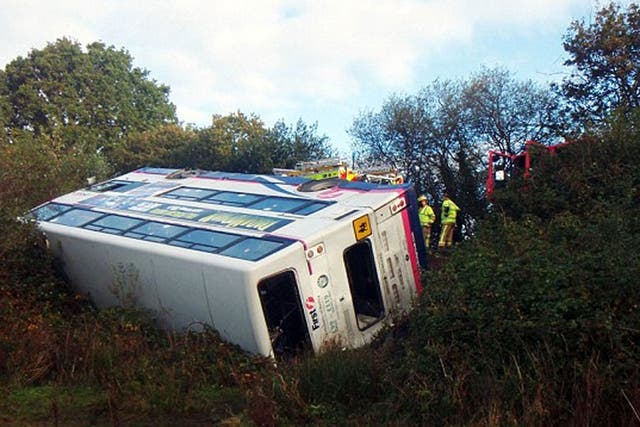 A double decker bus carrying 56 college students has crashed and overturned in a field in Dorset.