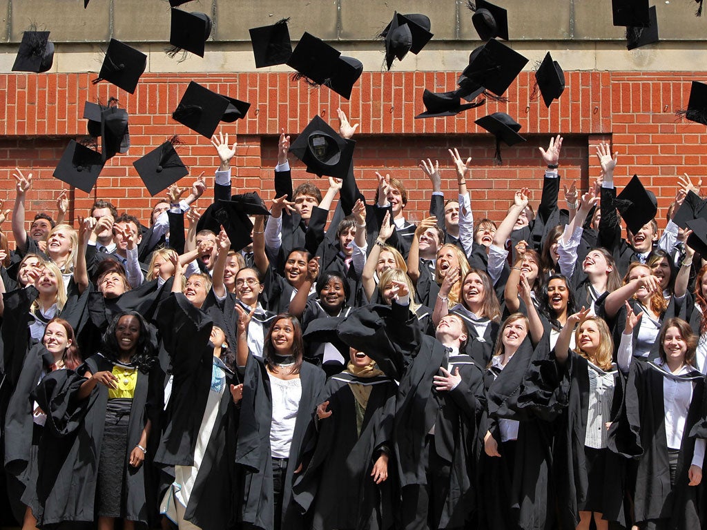 Students throw their mortarboards in the air during their graduation photograph at the University of Birmingham degree congregations on July 14, 2009 in Birmingham, England.