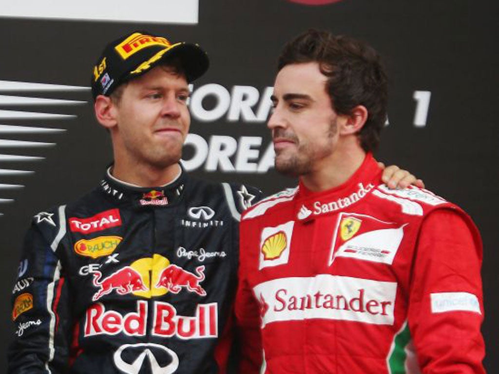 Rivals Sebastian Vettel (left) and Fernando Alonso