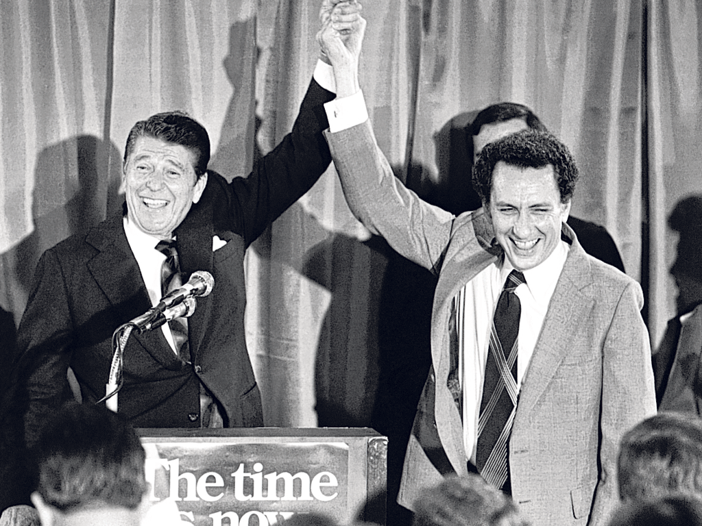 Ronald Reagan raises Specter's hand at a fund-raising party for Specter in 1980