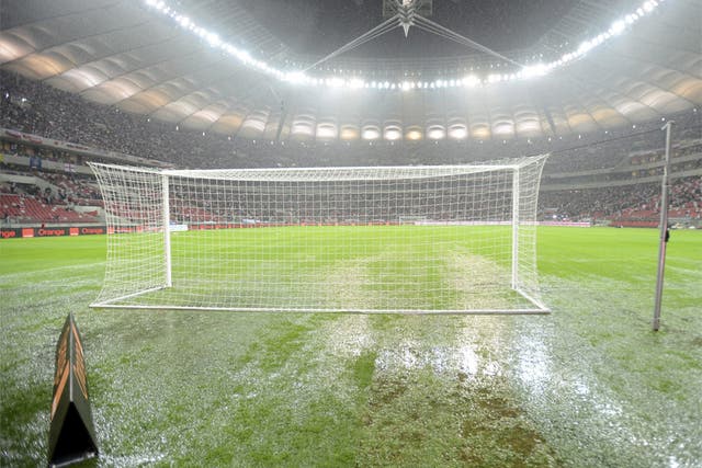 The puddle-ridden pitch at the National Stadium in Warsaw last night