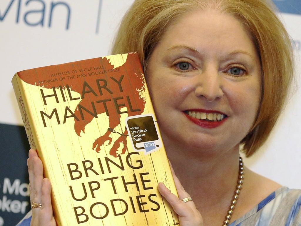 October 16, 2012: Author Hilary Mantel poses with her book 'Bring Up the Bodies', after winning the 2012 Man Booker Prize, at the Guildhall in London. Mantel wrote herself into the history books, becoming the first woman and first Briton to win the covete