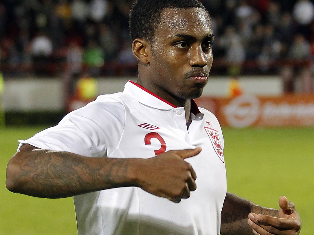 Danny Rose appears to make a monkey gesture as he leaves the pitch in response to taunts from Serbia fans