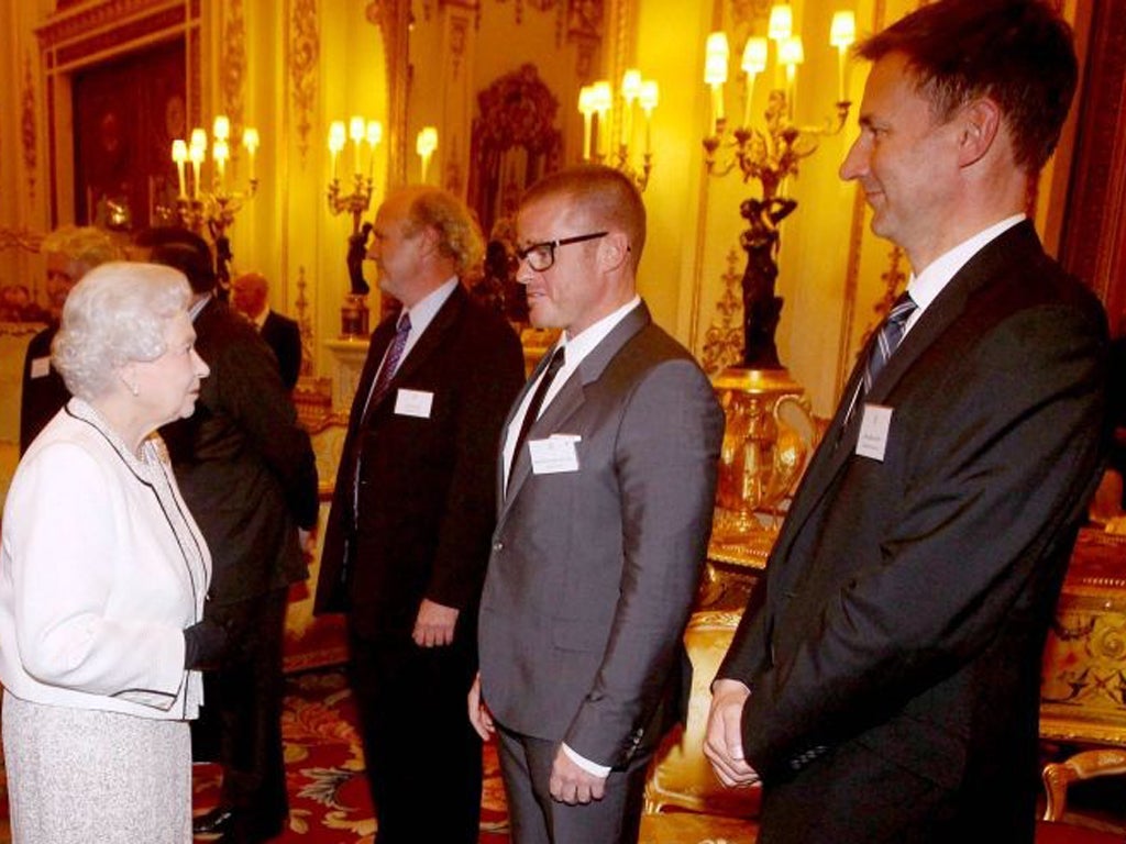 The Queen talks to TV chef Heston Blumenthal before hearing Jeremy Hunts badly-received joke