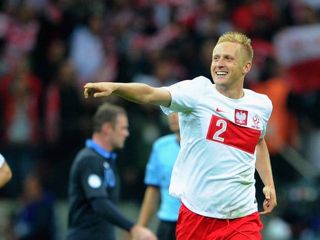 Kamil Glik celebrates his equaliser for Poland