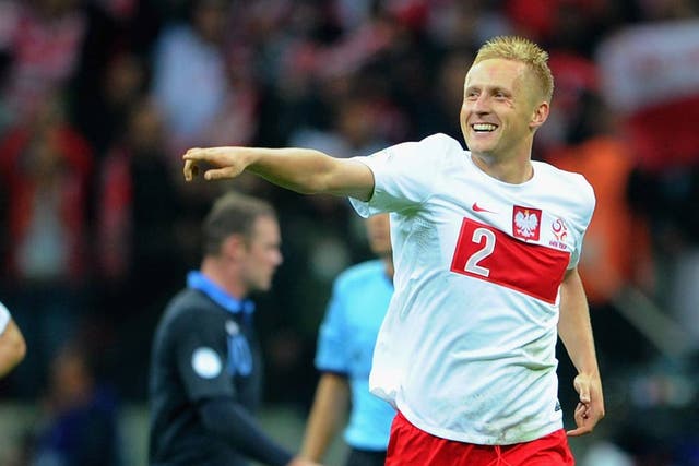 Kamil Glik celebrates his equaliser for Poland
