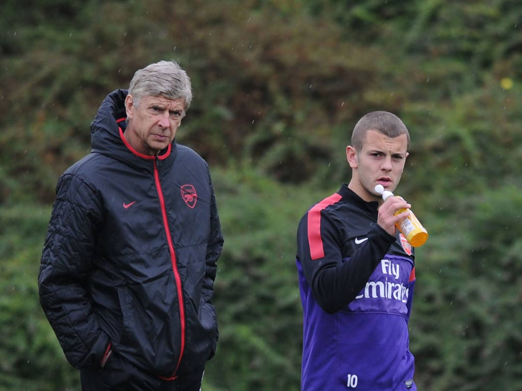 Jack Wilshere and Arsene Wenger pictured during training