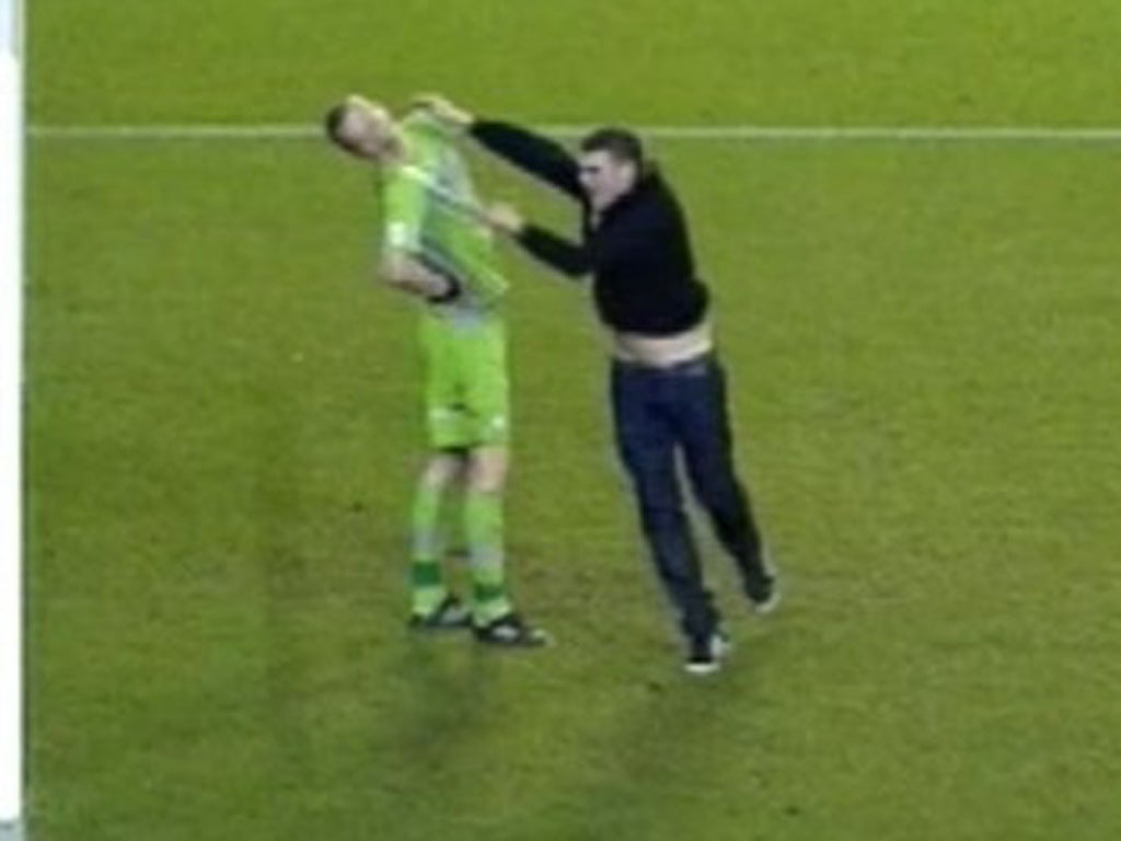 The moment the Leeds United fan attacked Sheffield Wednesday goalkeeper Chris Kirkland during last name's game