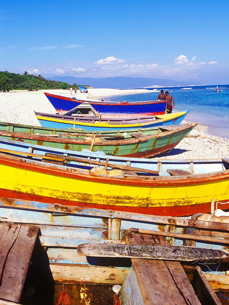 Catch of the day: Bright kayaks and fishing boats line the beach