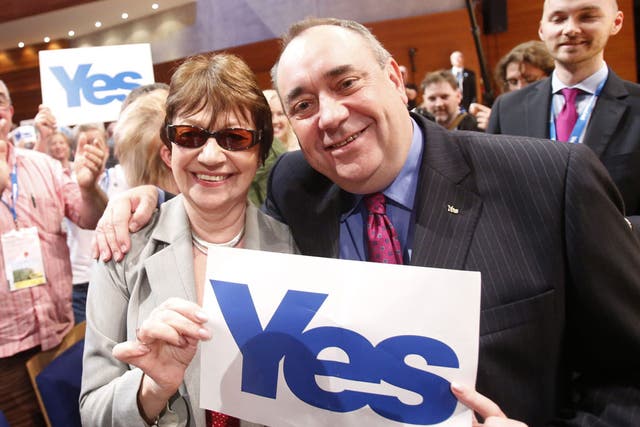 Salmond poses with a supporter in Perth yesterday