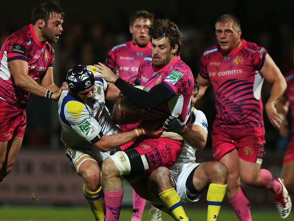 No way through: Aly Muldowney of Exeter Chiefs is tackled by Julien Bonnaire of Clermont Auvergne