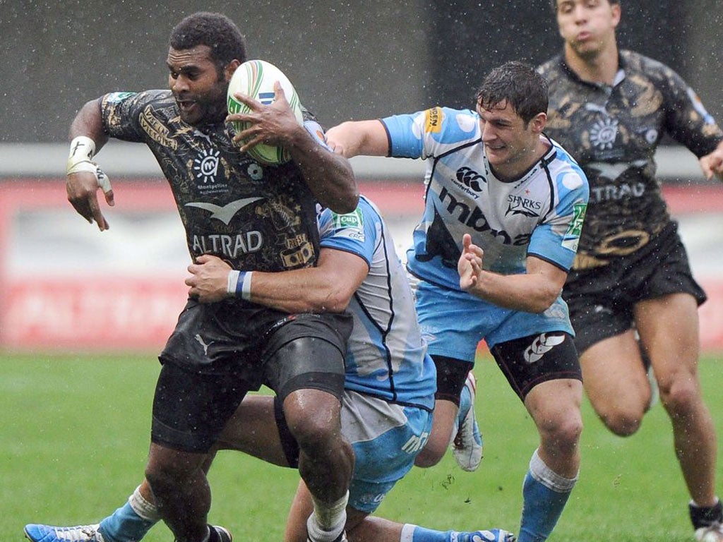 Montpellier’s Jim Nagusa is halted in the wet by the Sale cover
