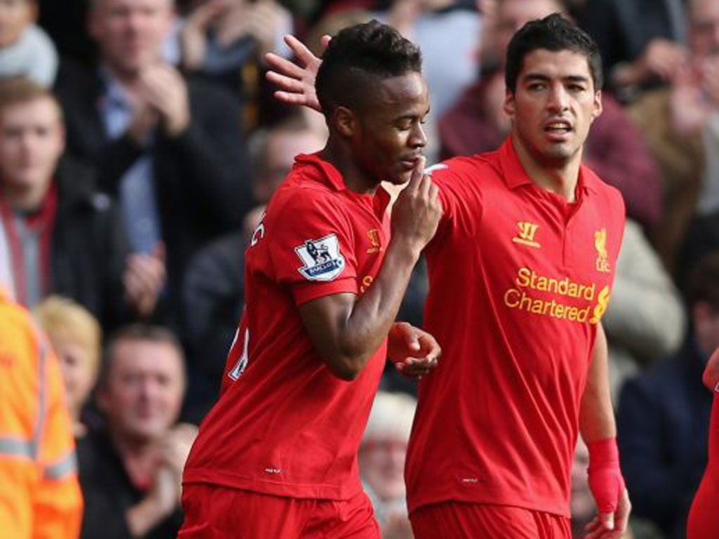 Raheem Sterling is congratulated by Luis Suarez after his winner