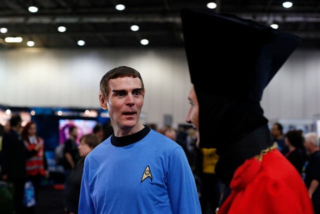 Star Trek fans walk through the exhibition hall at the "Destination Star Trek London" convention in London October 19, 2012. 