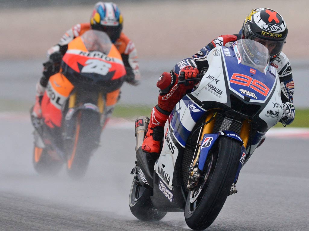 Yamaha rider Jorge Lorenzo of Spain (right) is followed by Honda rider Dani Pedrosa