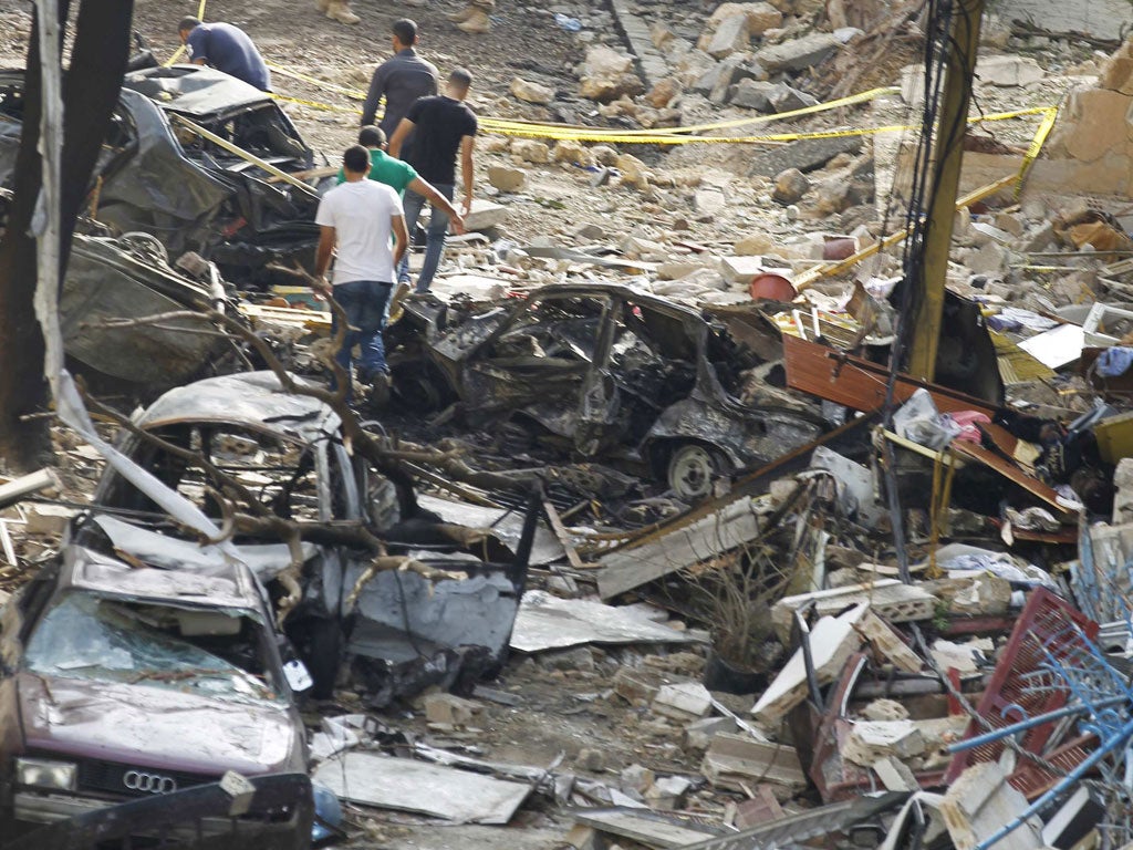 Police inspect the site of the explosion that killed eight people last week