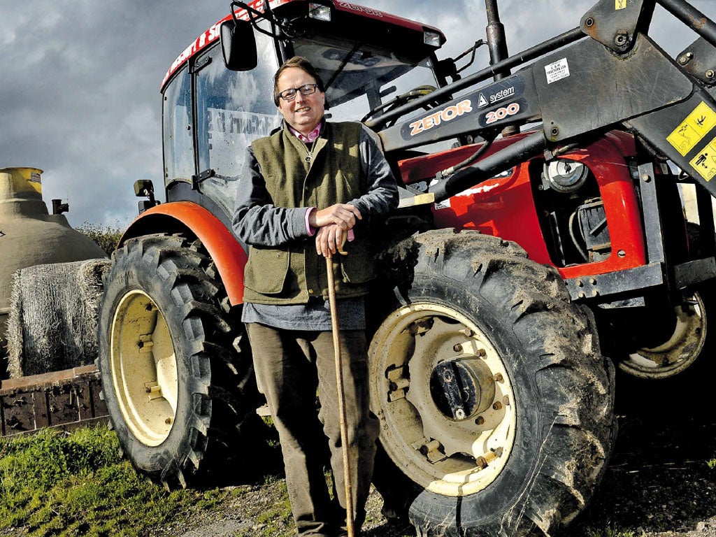 Still standing: Jan McCourt with his tractor