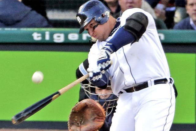 Tigers' Miguel Cabrera hits a home run against the Yankees