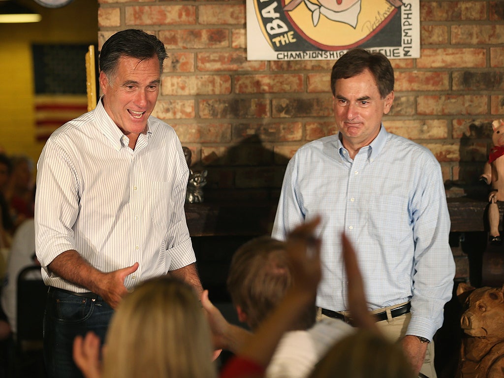 Mitt Romney and Richard Mourdock greet supporters at a campaign event in Indiana in August