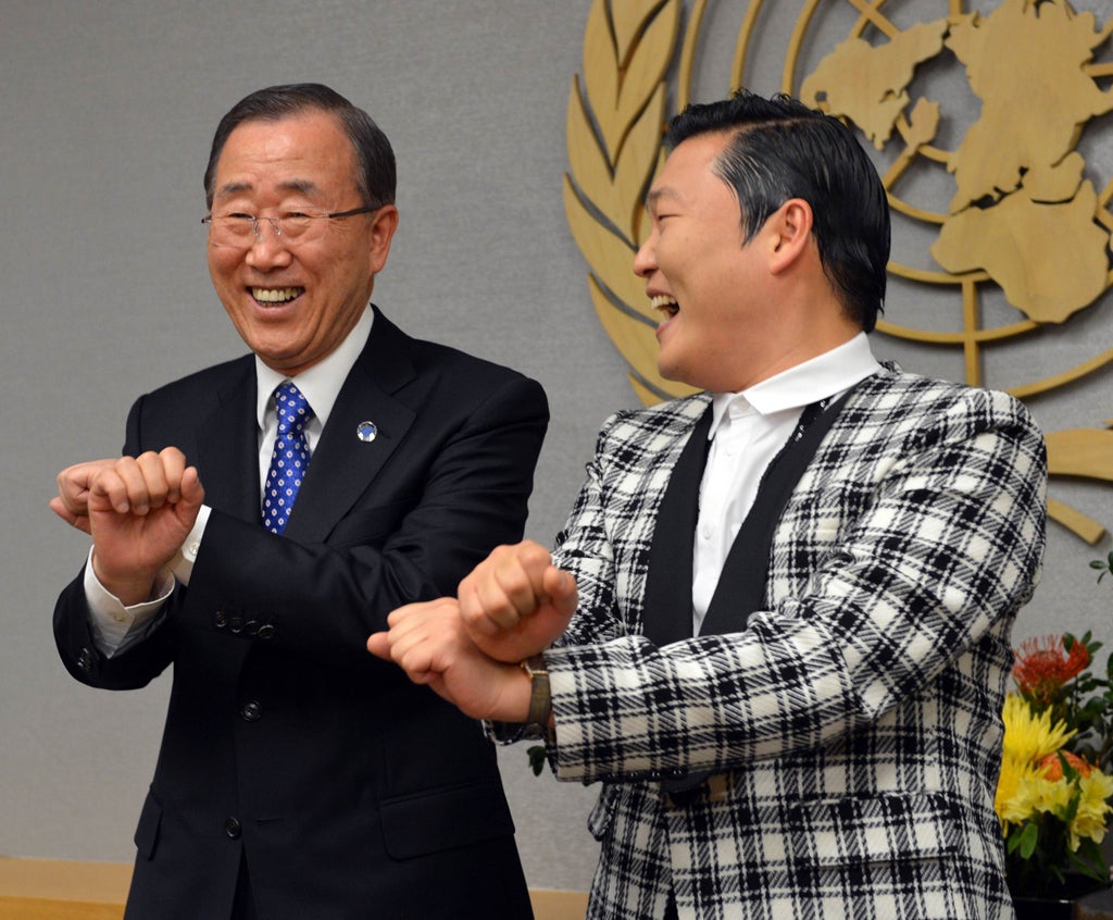 South Korean singer Psy whose real name Park Jae-sang, does a dance-step with United Nations Secretary General Ban Ki-Moon