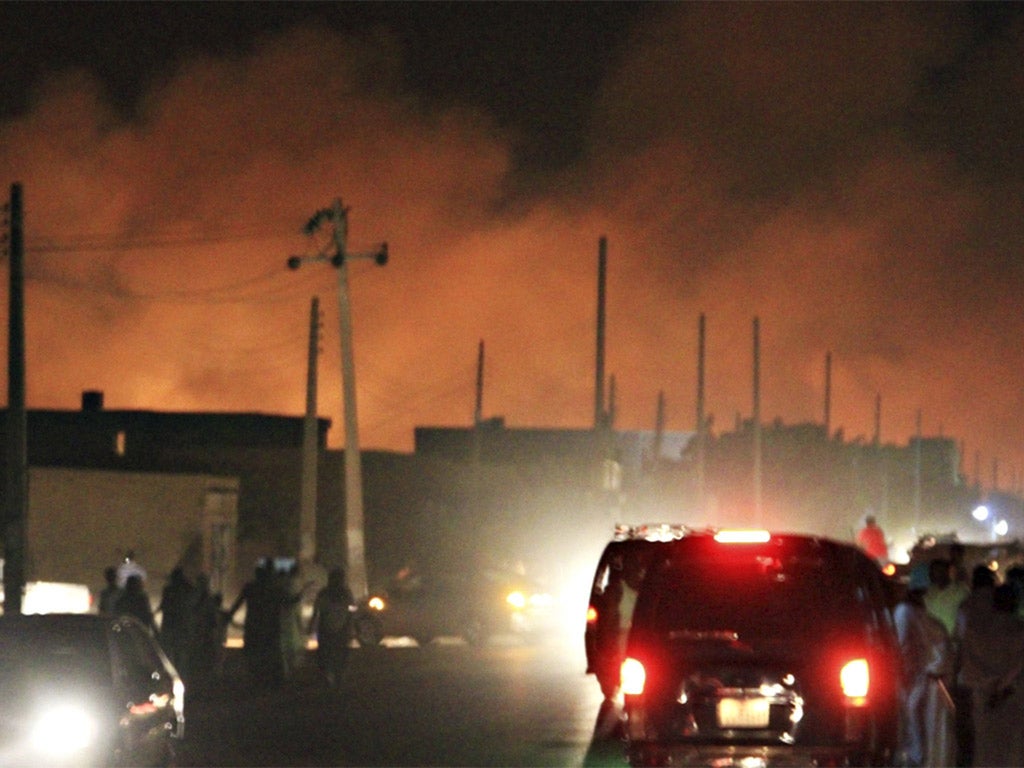 A fire breaks out following Tuesday night's air strike, which killed two people