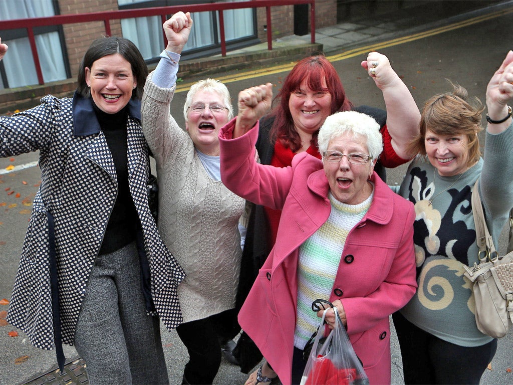 Current and former Birmingham Council workers celebrate after yesterday's Court judgement