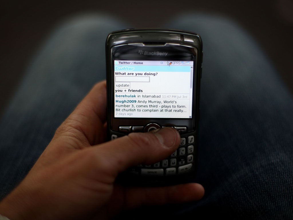 In this photo illustration the Twitter website is displayed on a mobile phone on July 6, 2009 in London.