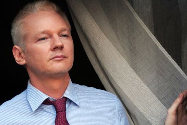 Assange appearing on the embassy's balcony in August